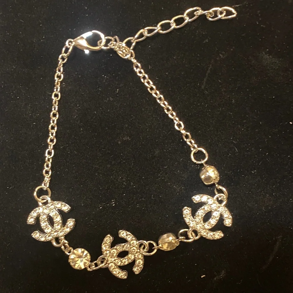 Elegant Silver toned CC Bracelet with Crystal Accents